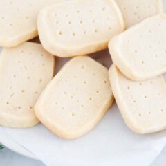 Buttery classic shortbread cookies on a white plate.