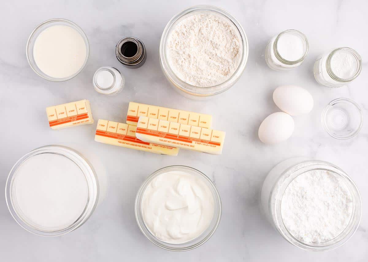 Sugar cookie ingredients on a marble counter.