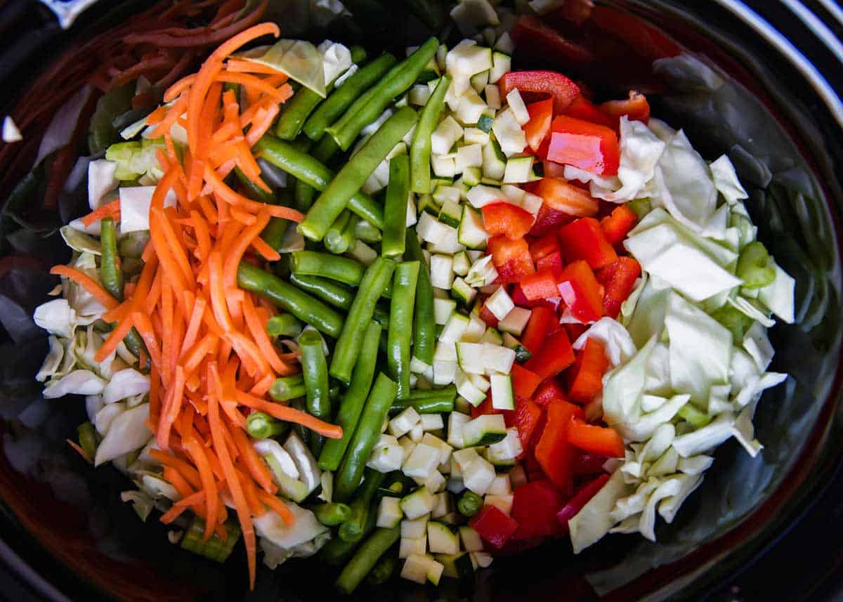 Cabbage soup ingredients in a crockpot.