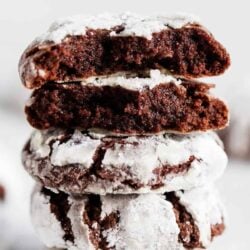 Stacked chocolate crinkle cookies.