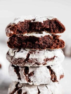 Stacked chocolate crinkle cookies.