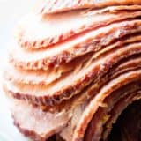 Spiral ham on a white plate.