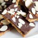 Graham cracker toffee on a white plate.