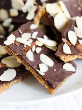 Graham cracker toffee on a white plate.