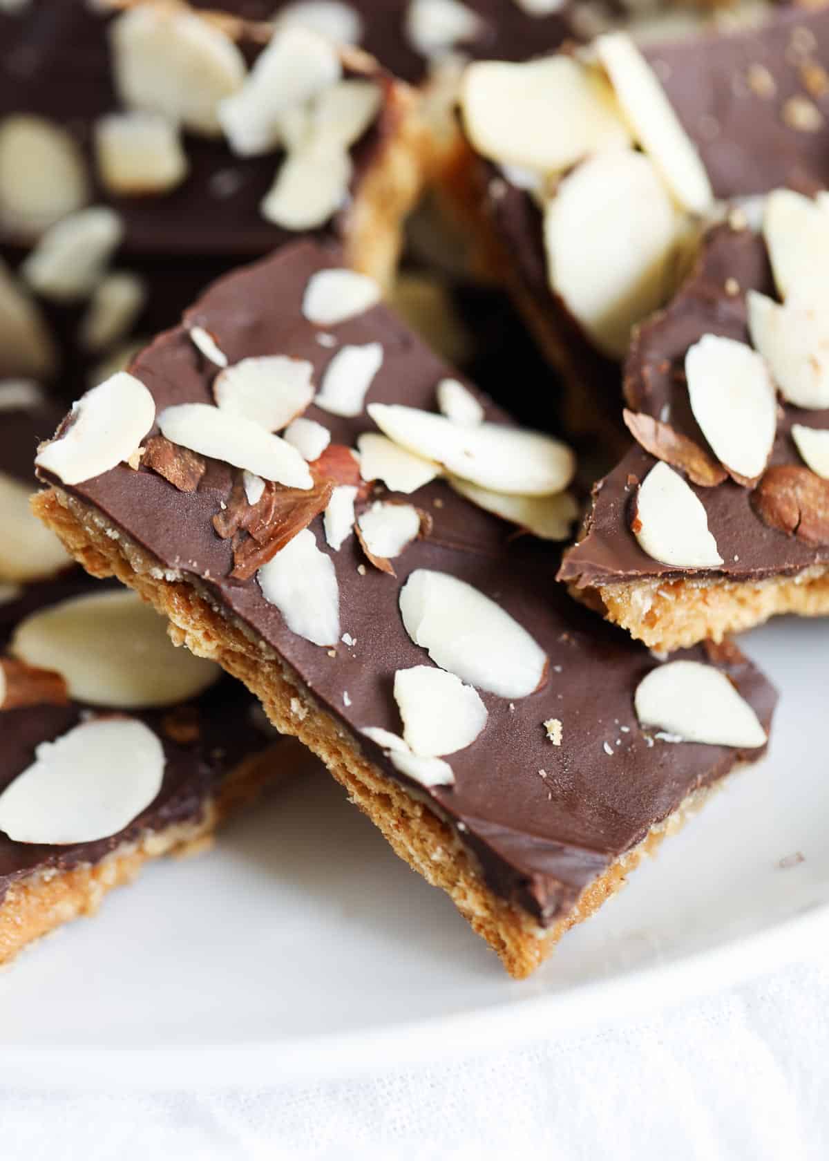 Graham cracker toffee on a white plate.