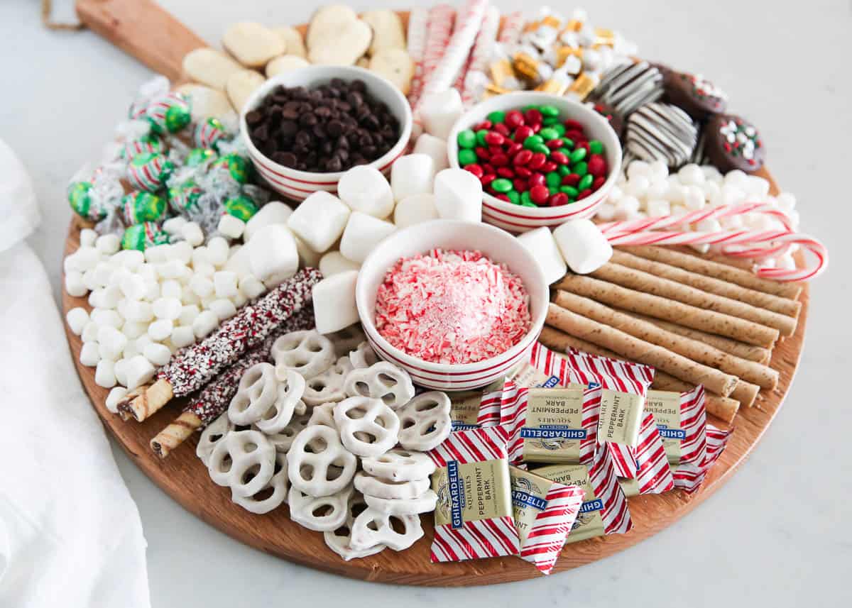 Hot chocolate charcuterie board on marble counter.