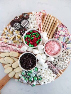 Hot chocolate charcuterie board on marble counter.