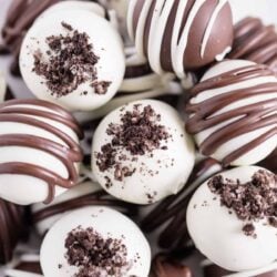 Oreo balls stacked on a plate.