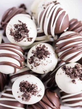 Oreo balls stacked on a plate.