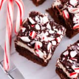 Peppermint brownies with candy canes on top.