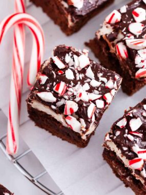 Peppermint brownies with candy canes on top.