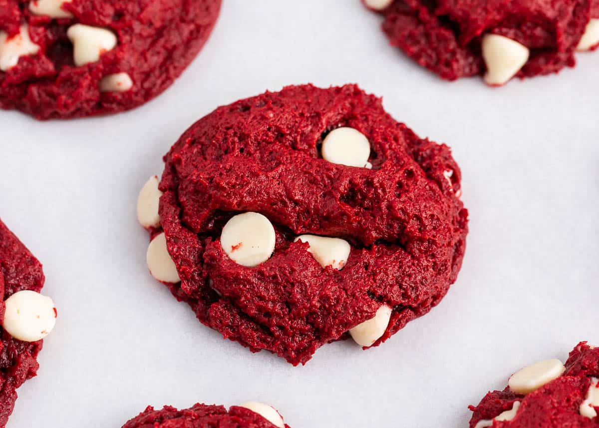 Soft and delicious red velvet cake mix cookies are loaded with white chocolate chips in every bite. Ready in less than 30 minutes with only a handful of ingredients, they will become a new holiday favorite! Red velvet cake mix cookies with white chocolate chips.