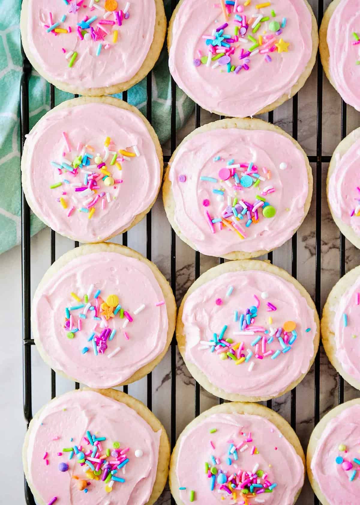 Sugar cookies on a cooling rack.