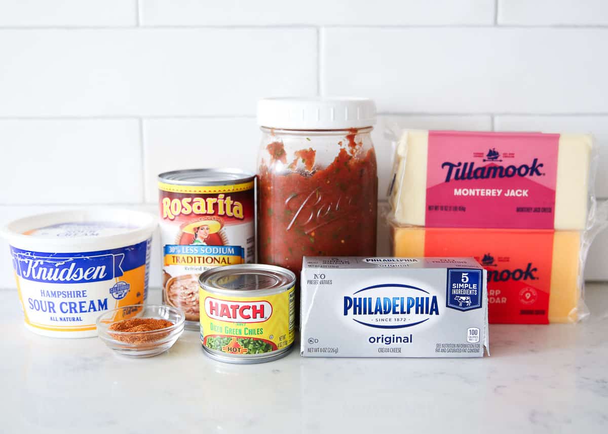 Bean dip ingredients on marble counter.