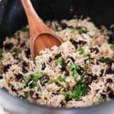 Black beans and rice in a black pot.