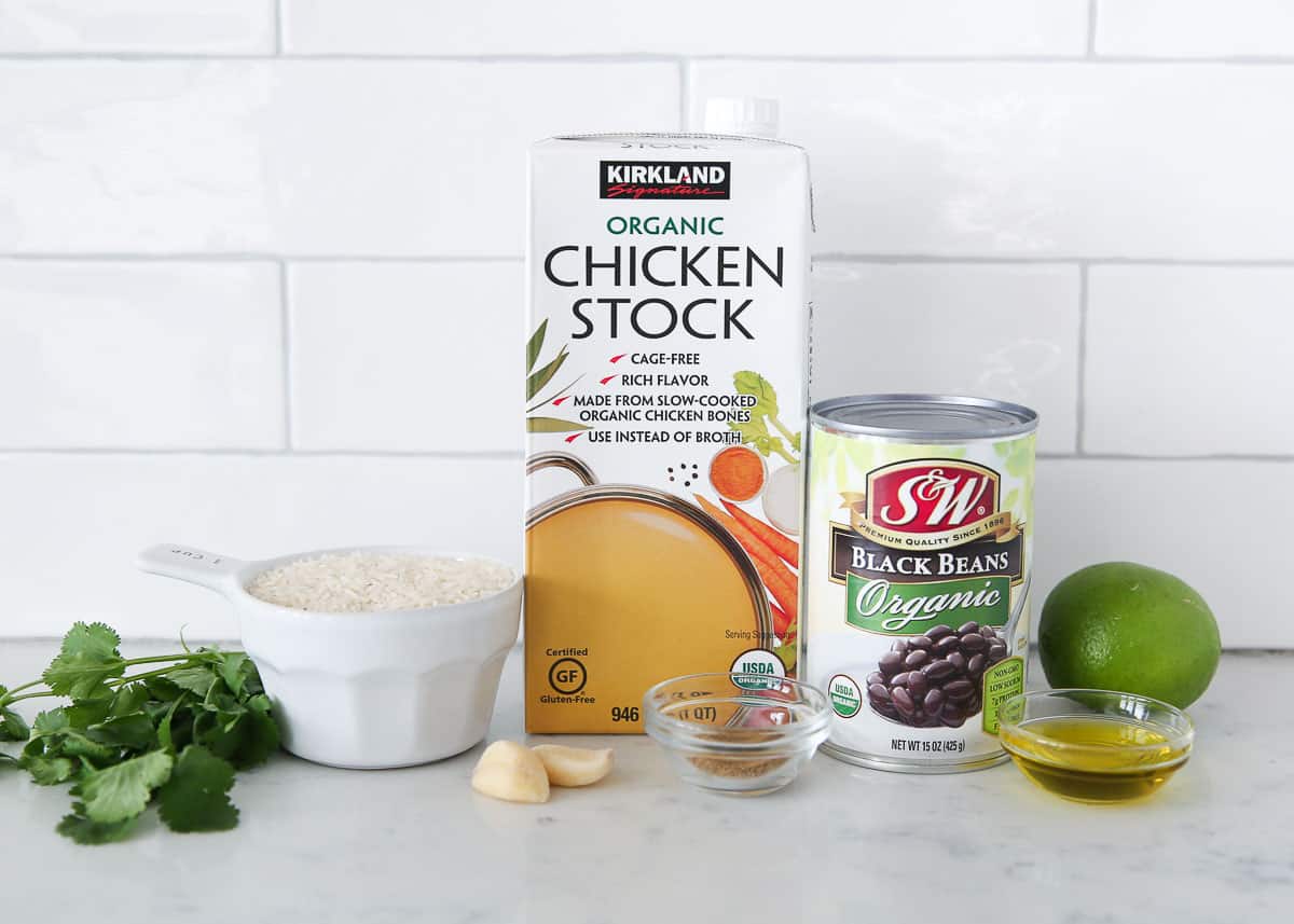 Black beans and rice ingredients on a counter.