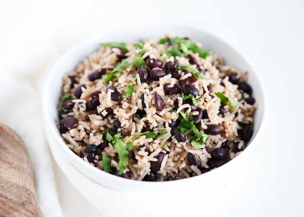 Black beans and rice in a white bowl.