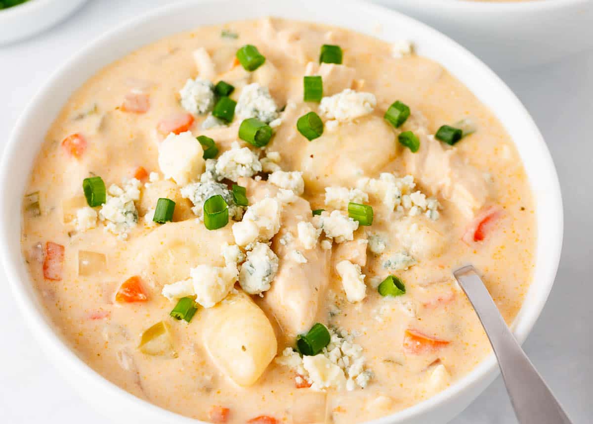 Buffalo chicken soup in a white bowl.