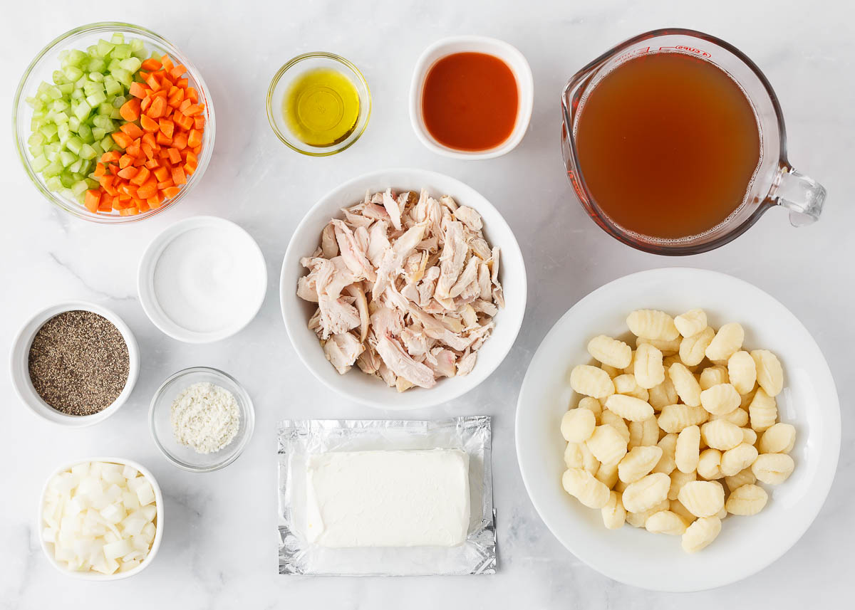 Buffalo chicken soup ingredients on the counter.