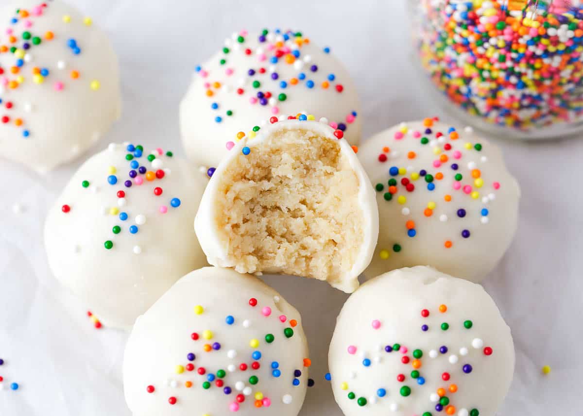 Cake balls with a bite taken.