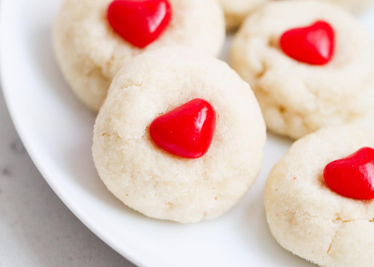 Valentine's Day sugar cookies with a heart candy in the middle of the cookie.