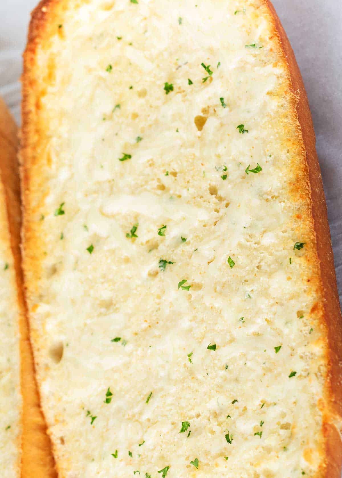 Garlic bread loaf on pan.