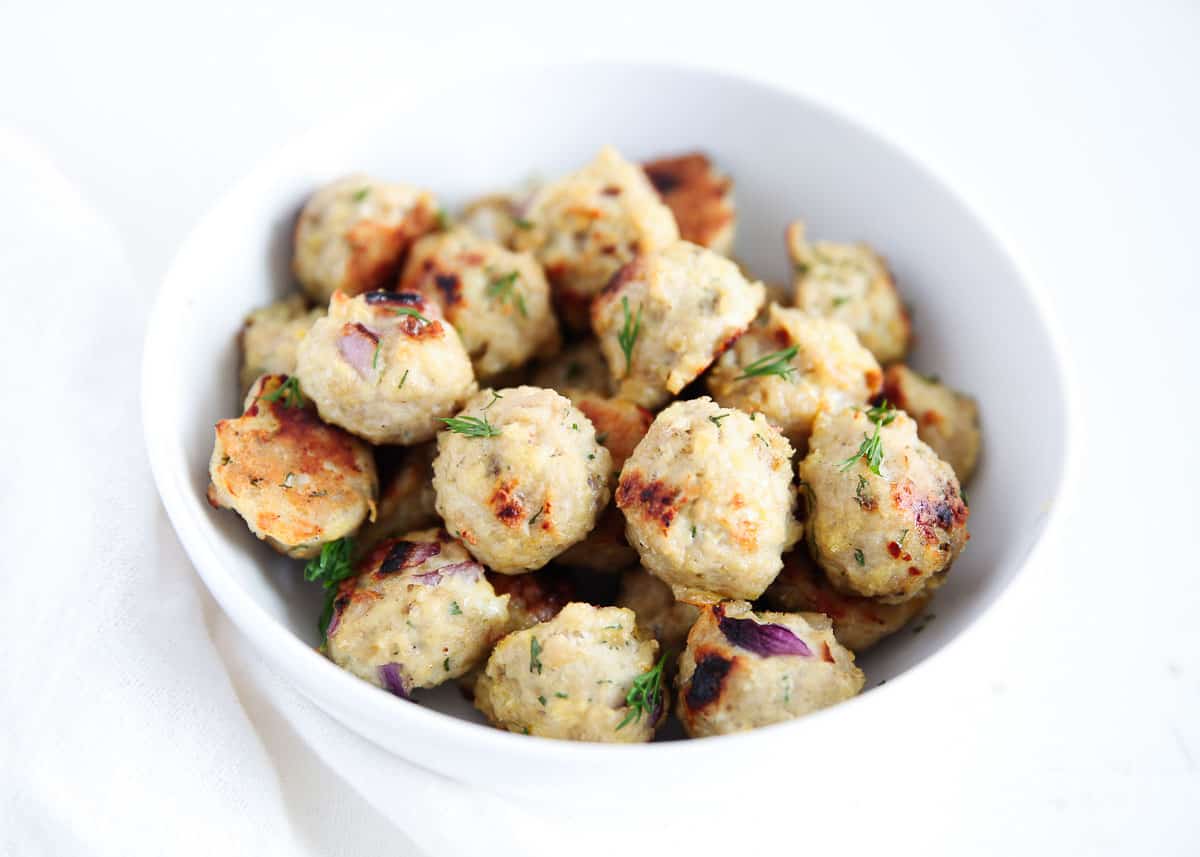 Greek meatballs in a white bowl.