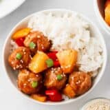 Hawaiian meatballs in a bowl with rice.