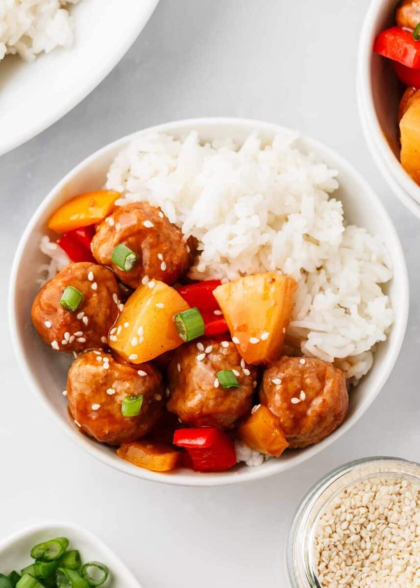 Hawaiian meatballs in a bowl with rice.