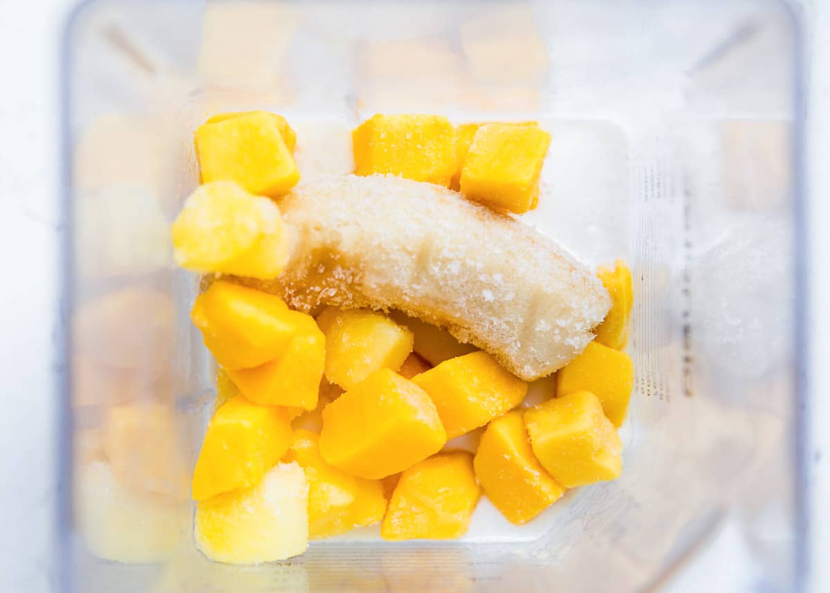 This healthy pineapple smoothie is creamy, refreshing and tastes downright tropical. It's easy to make in only 5 minutes with 5 ingredients and is perfect for breakfast, snack, or anytime you crave something sweet and fruity! Pineapple smoothie ingredients in blender.