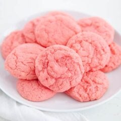Strawberry cake mix cookies on a white plate.