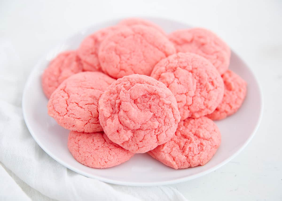 Strawberry cookies on a white plate. 