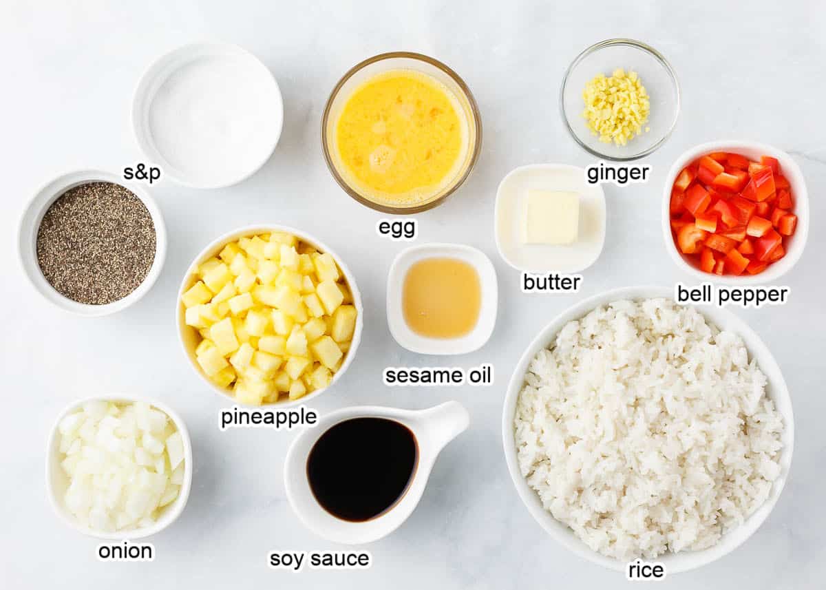 Pineapple fried rice ingredients on counter.