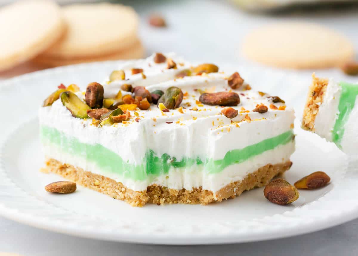 Pistachio dessert on a white plate.