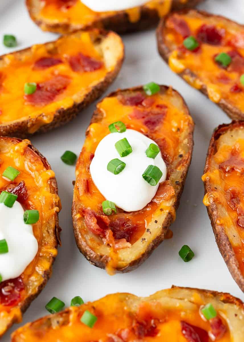 Potato skins with sour cream and green onions.