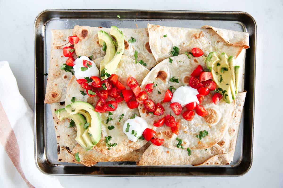 Sheet pan quesadilla on a metal baking sheet.