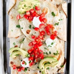 Sheet pan quesadilla on a metal baking sheet.