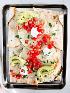 Sheet pan quesadilla on a metal baking sheet.