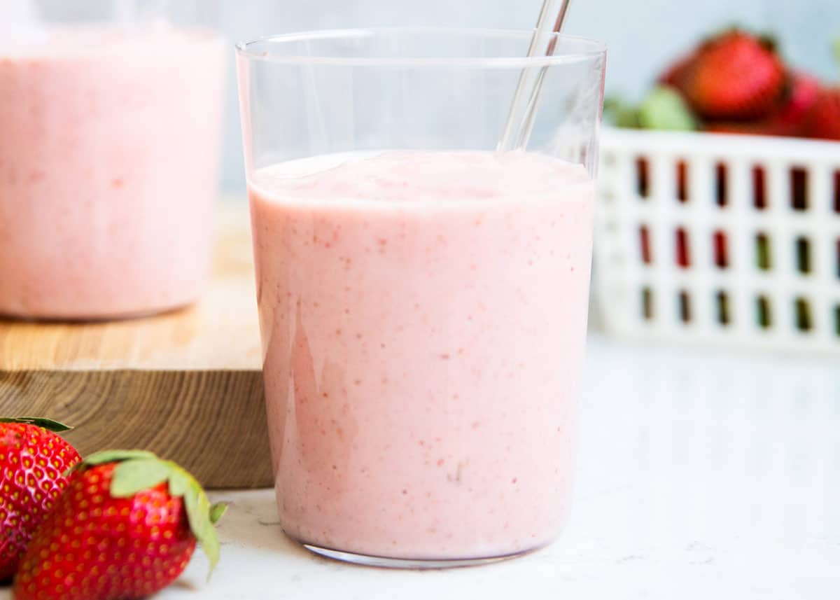 Strawberry banana smoothie in a glass cup.