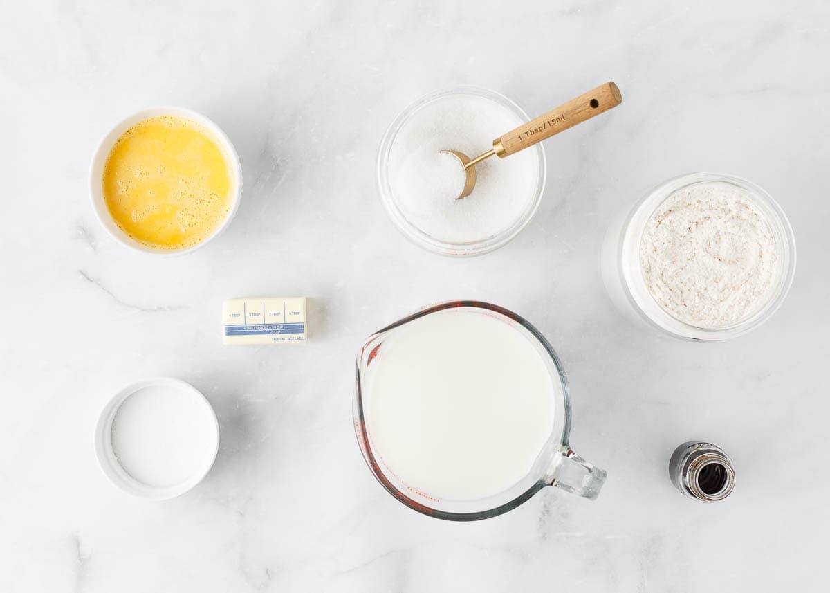 Ingredients for Swedish pancakes recipe on a counter.