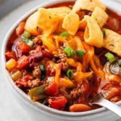 Wendy's chili in a white bowl with spoon.