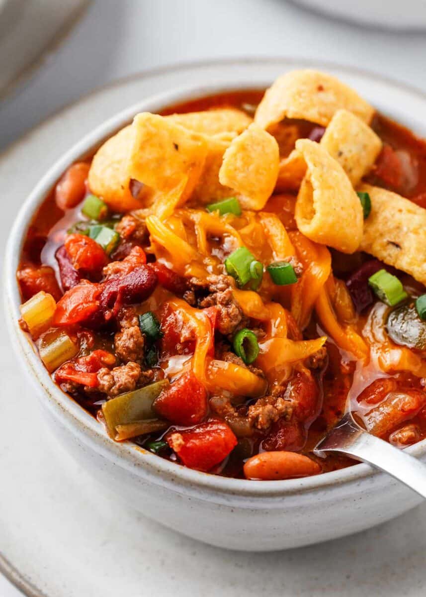 Wendy's chili in a white bowl with spoon.