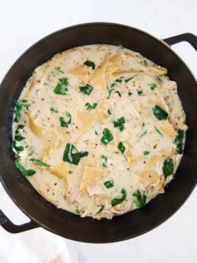 White lasagna soup in a black stockpot.