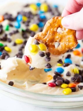 Cheesecake dip in a glass dish.