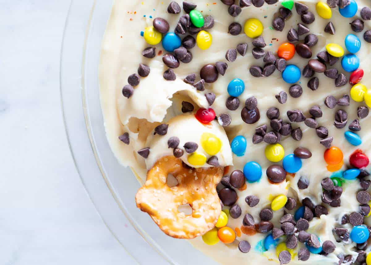 Cheesecake dip in a glass dish.