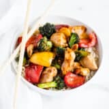 Chick stir fry in a white bowl.