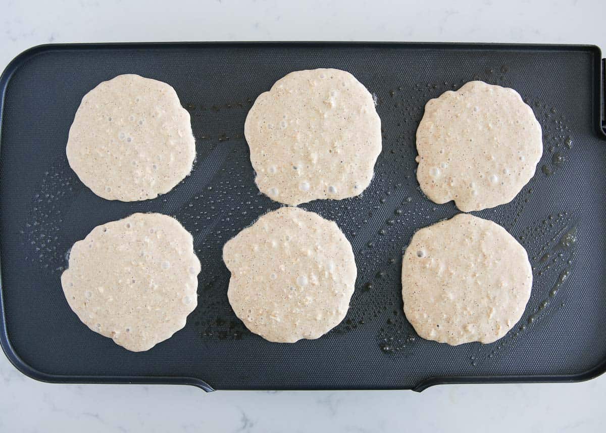 Blender oatmeal pancakes on the griddle.