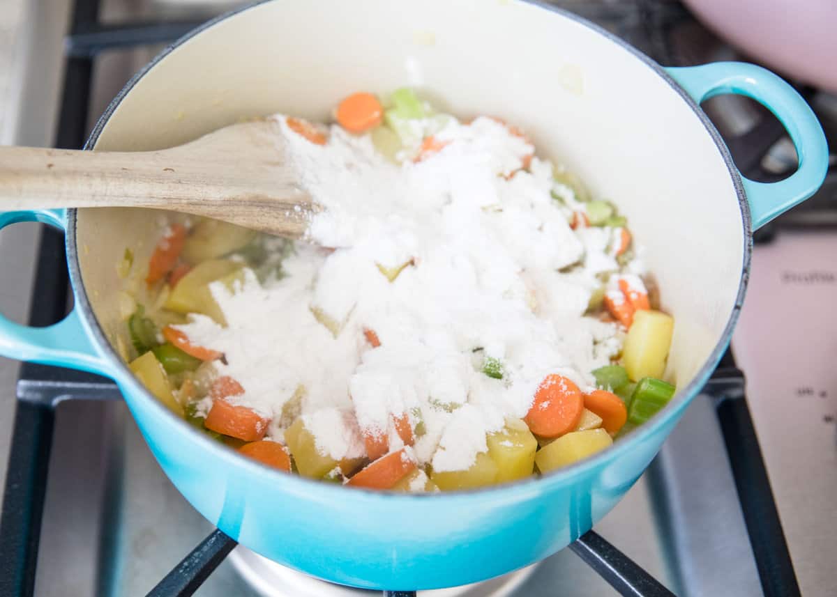 Cooking potatoes and flour in a pot.