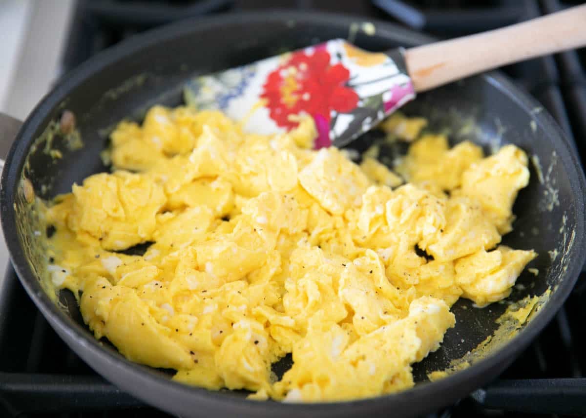 Soft, fluffy scrambled eggs finished in the skillet.