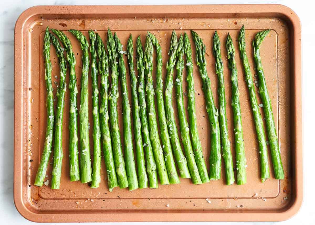 Roasted asparagus on a baking pan. 